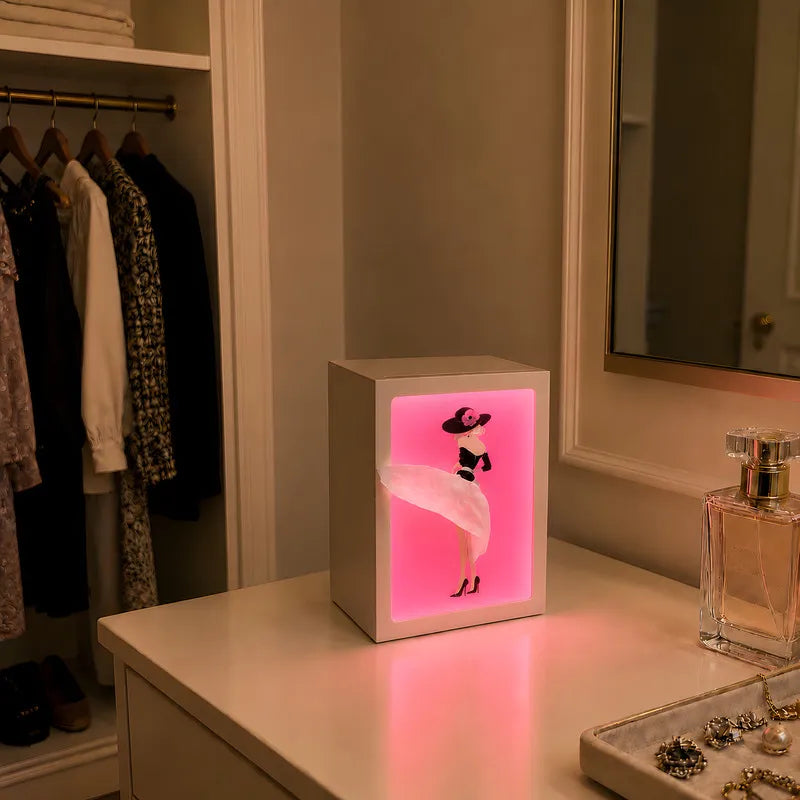 Lighted tissue box in Couture glowing in a closet