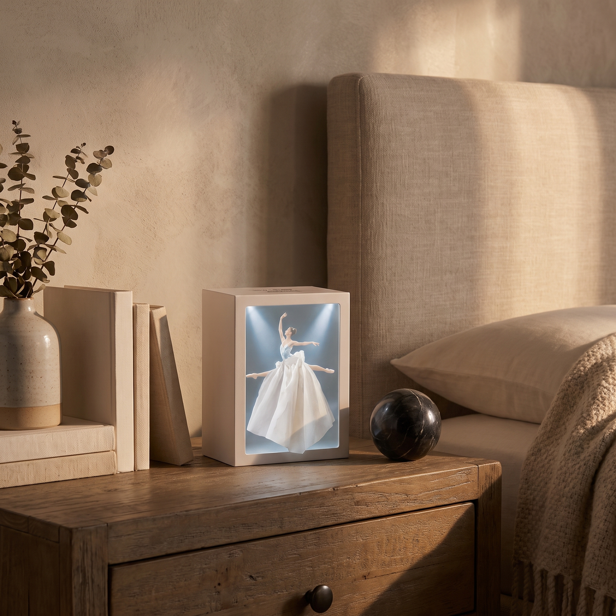 Lighted tissue box glowing on a bedside table