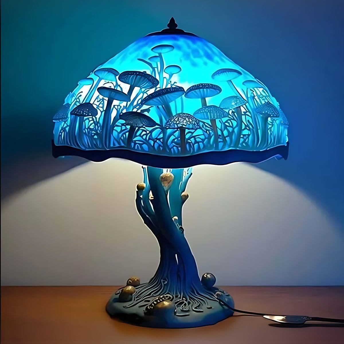 Blue Mushroom Majken table lamp lit on a table