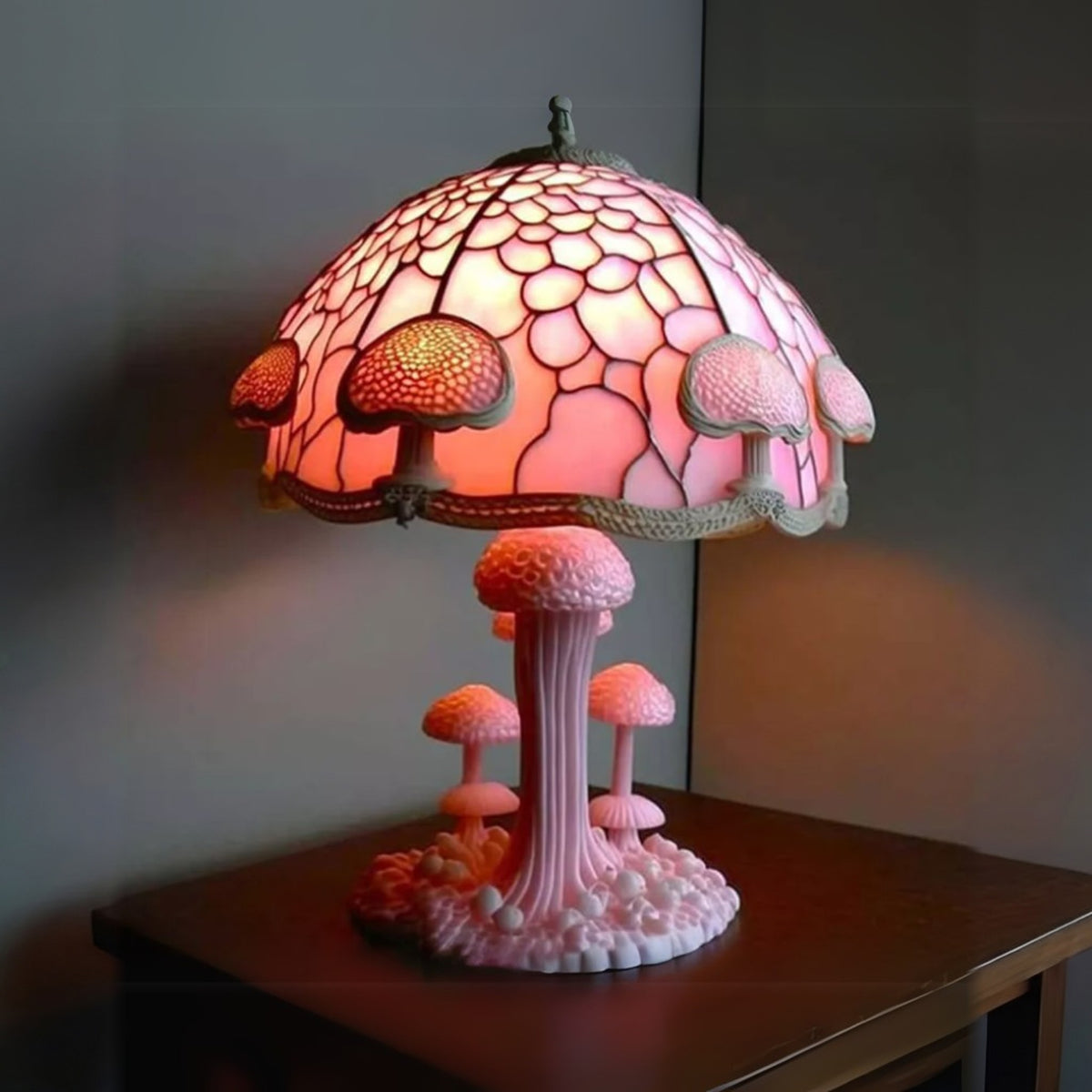 Pink Mushroom Majken table lamp lit on a side table