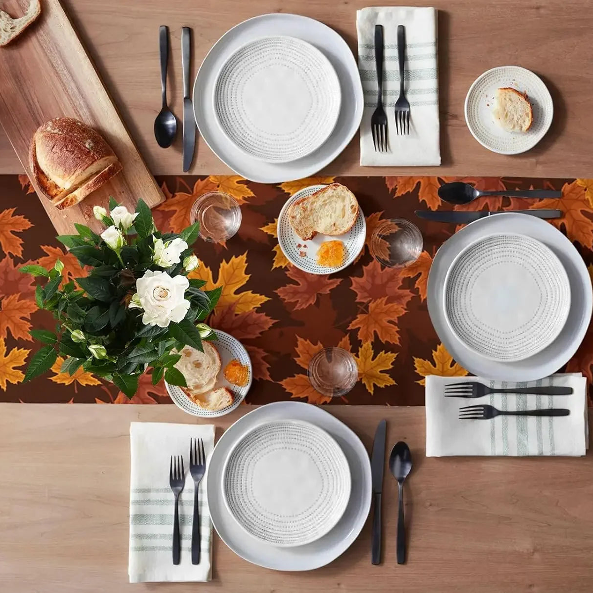 Maple leaf print runner on a table set for four from above