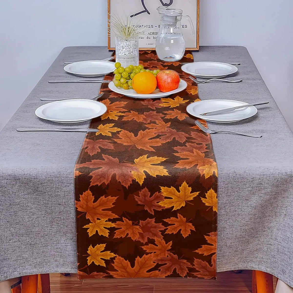Maple leaf print runner on a gray tablecloth