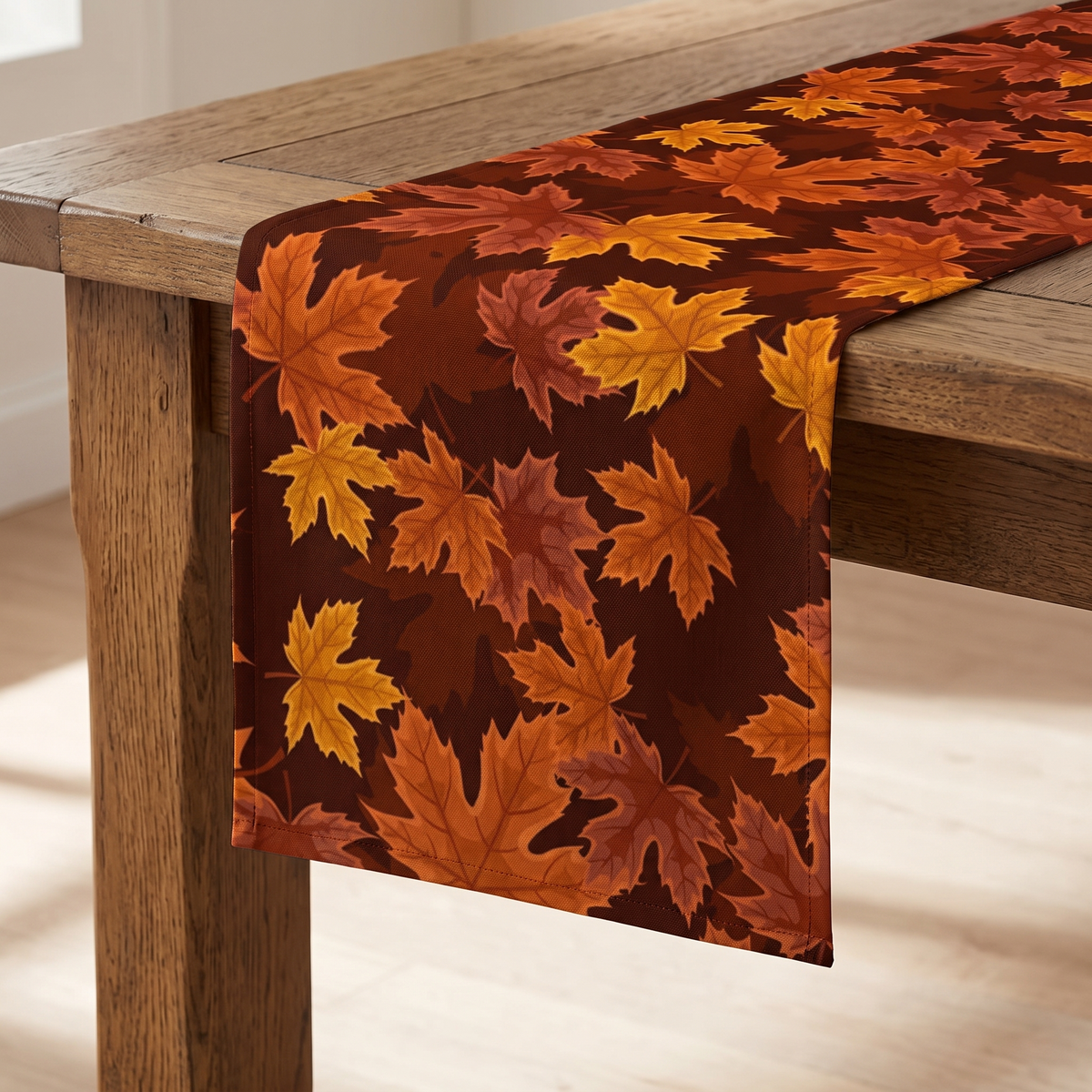 Close view of the printed orange, gold and rust maple leaves on deep brown