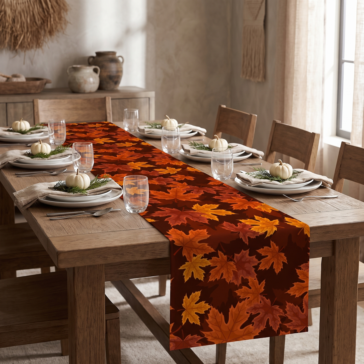 Maple leaf print runner down an oak table set for a fall dinner