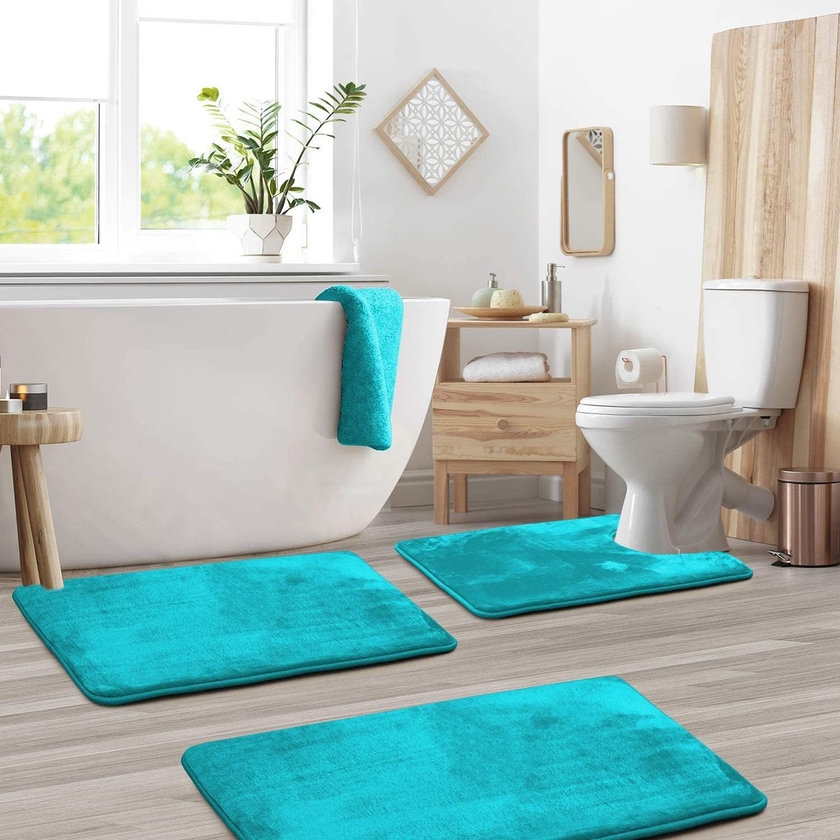 Teal bath mat set in a bathroom