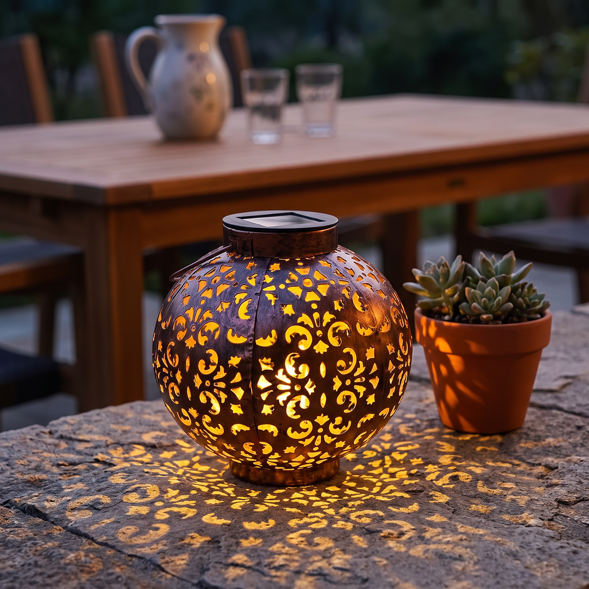 Mette solar lantern on a stone wall beside a patio table at dusk