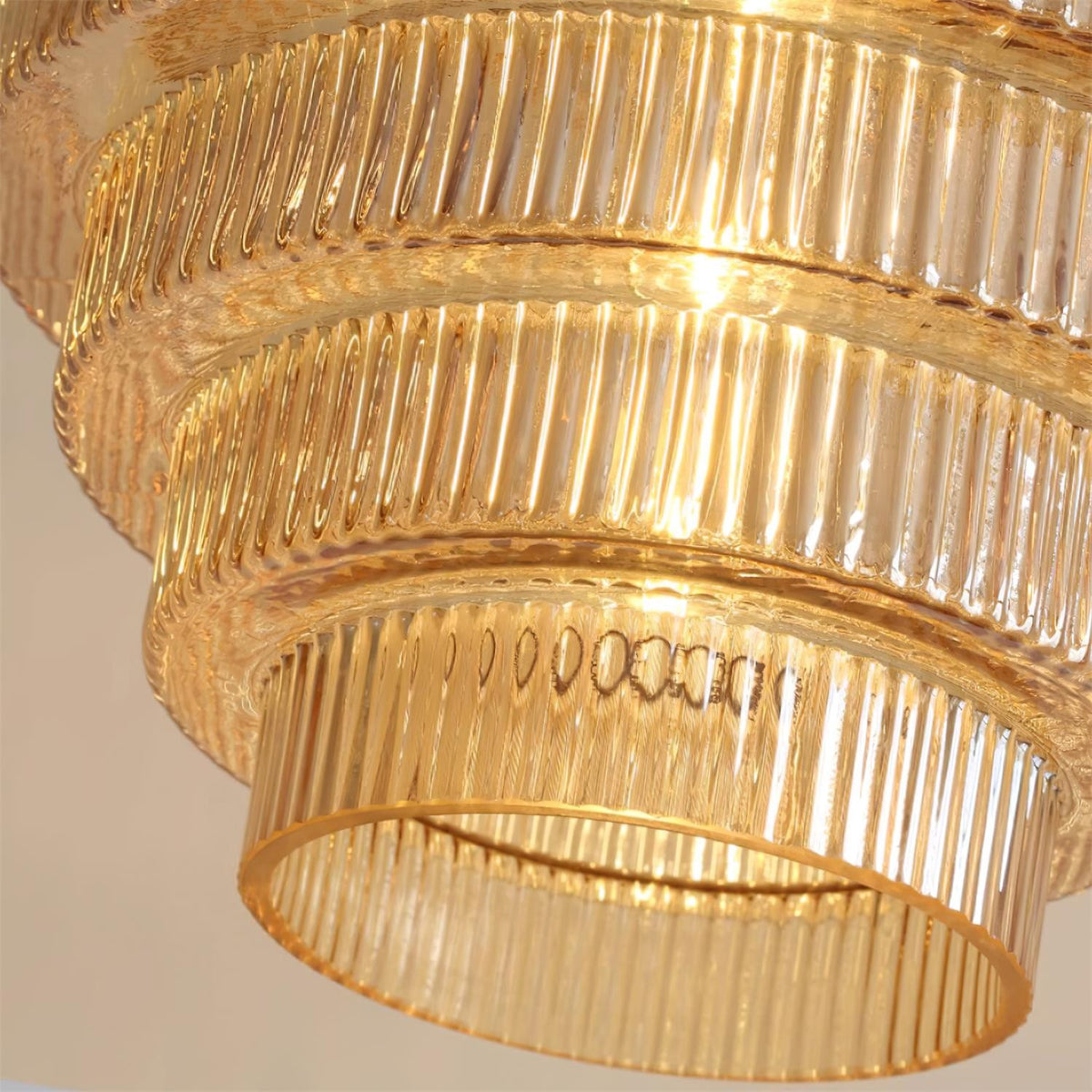 Close view of the amber ridged glass tiers of the Minna pendant