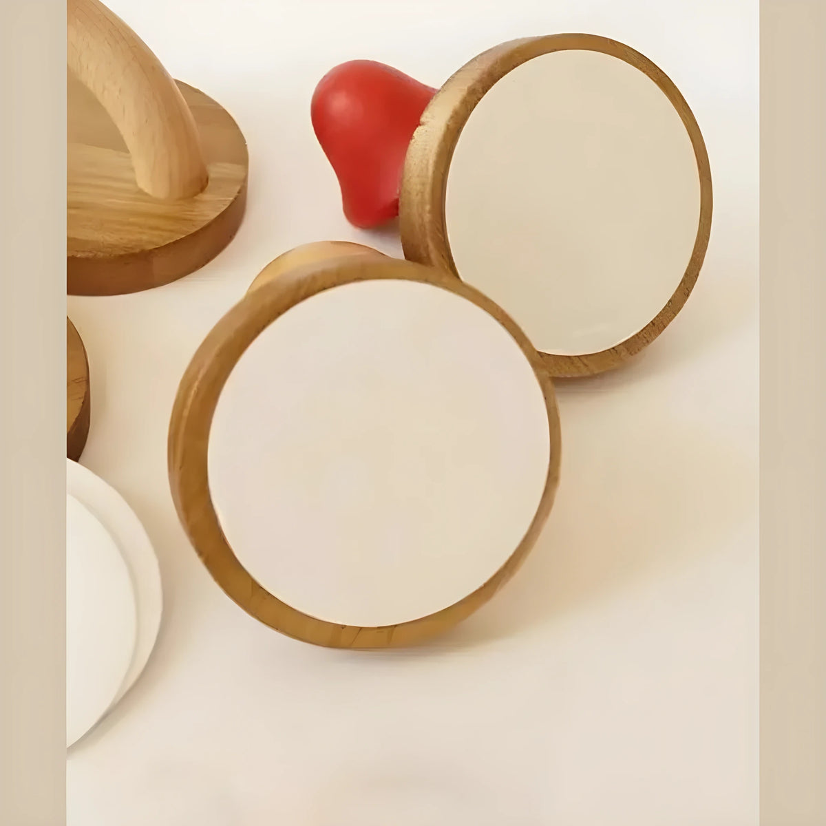 The round wood bases on the back of the mushroom hooks