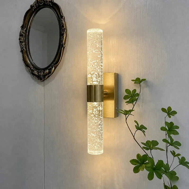 Namsos wall light with gold tone base and bubbled crystal column
