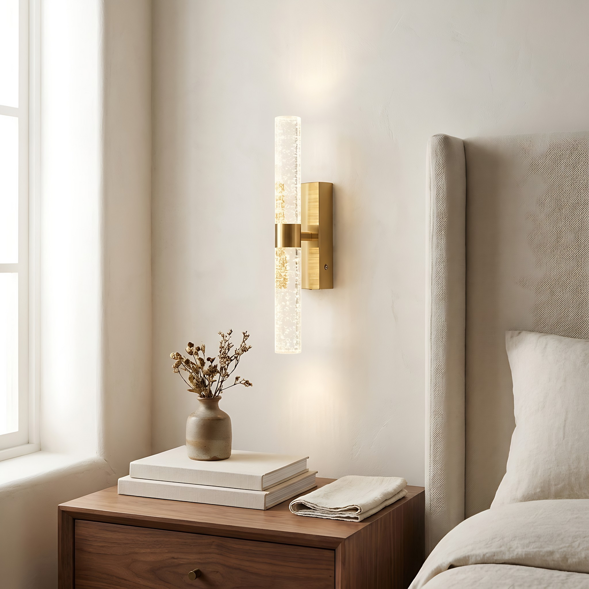 Namsos wall light beside a bed above a walnut nightstand