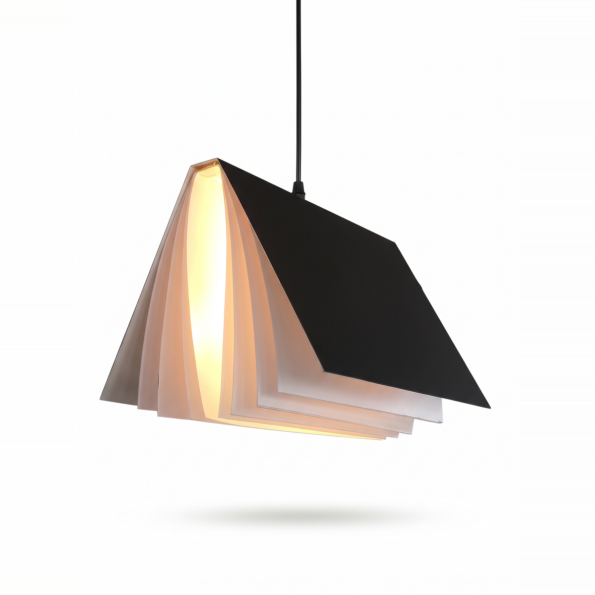 Black book pendant light lit on a white background