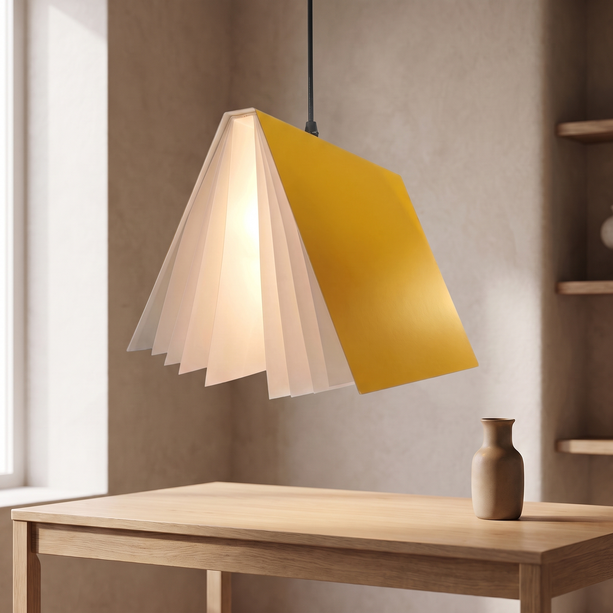 Nesna book pendant light in yellow, lit above an oak desk