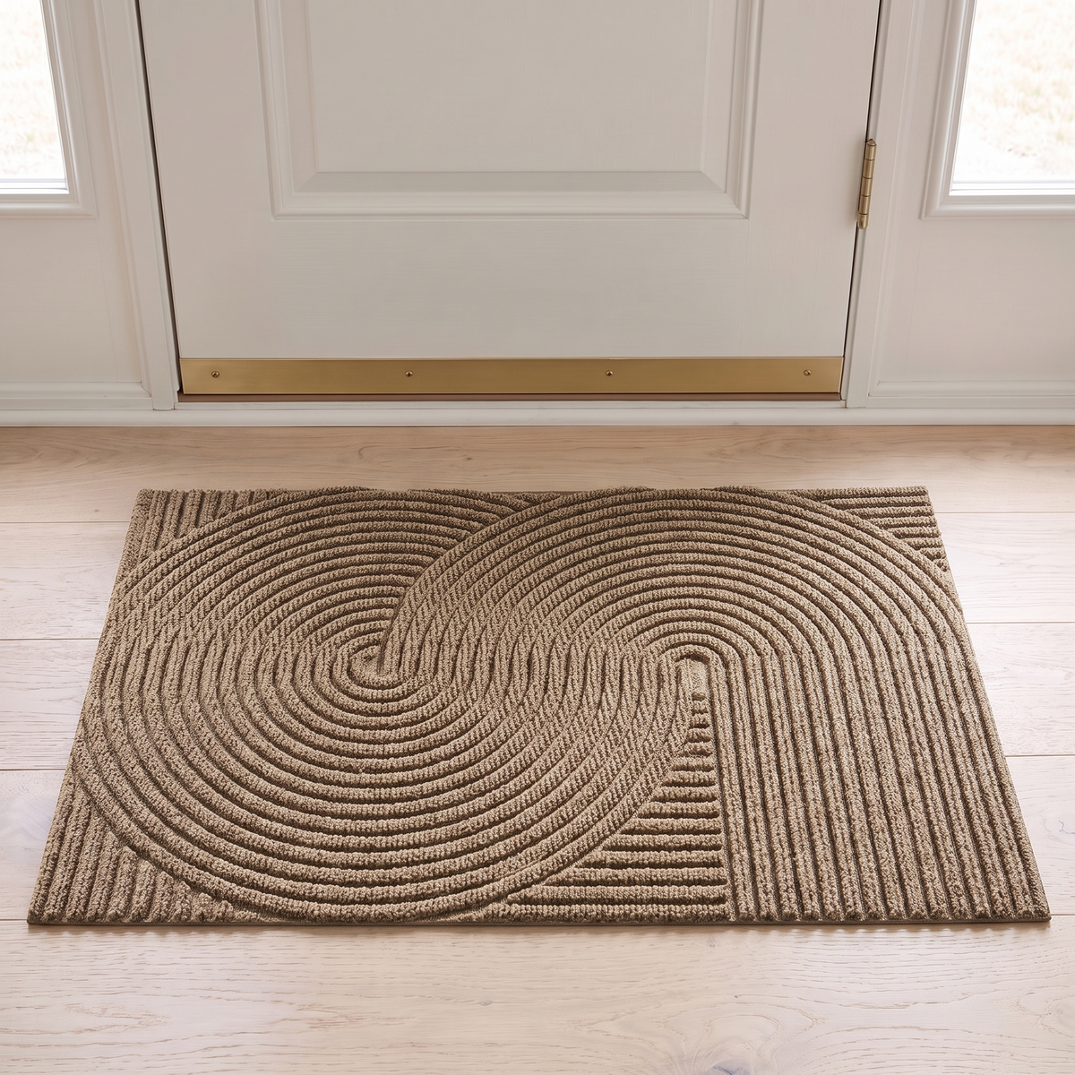 Non slip door mat in khaki inside a white front door