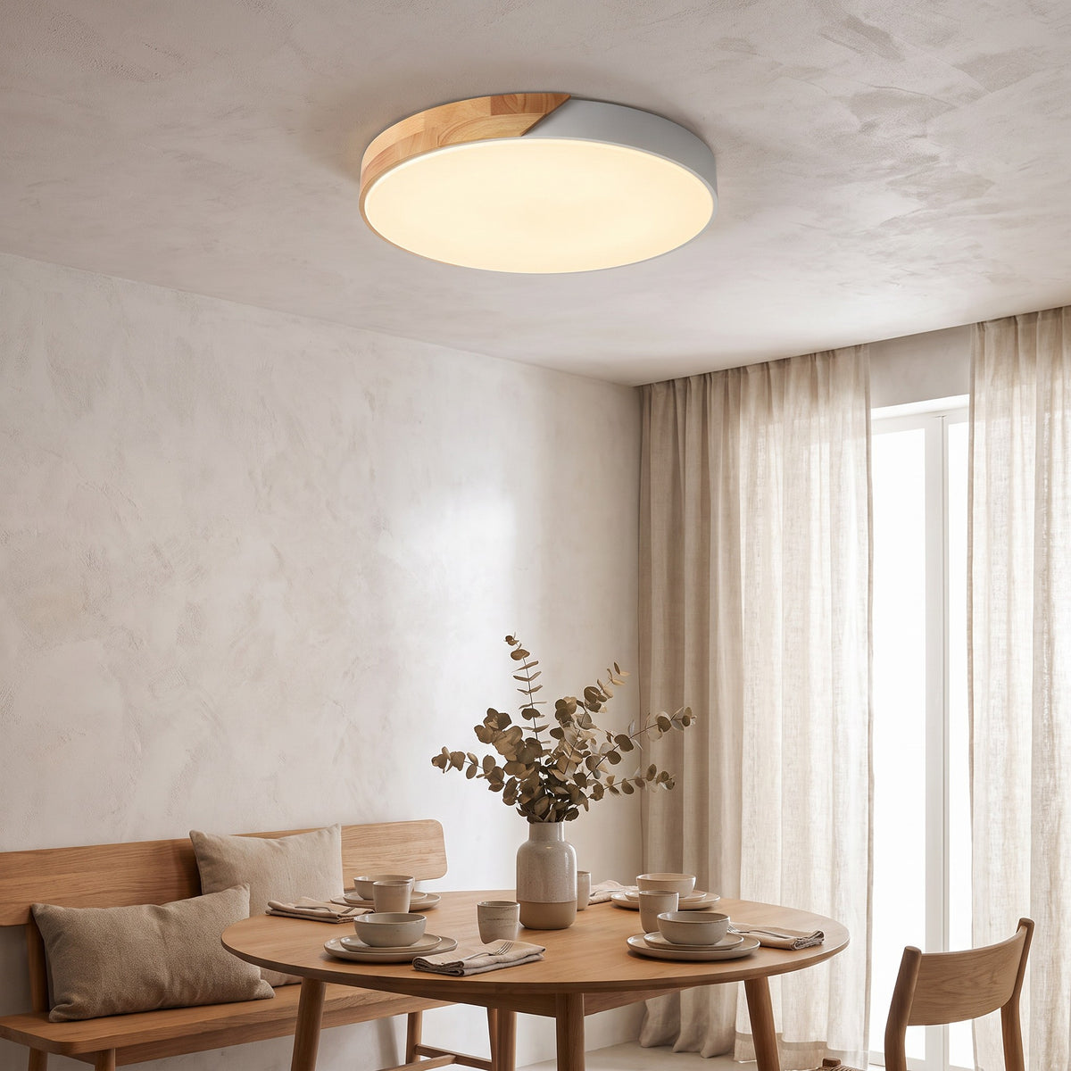 White Oda LED ceiling light over a dining nook