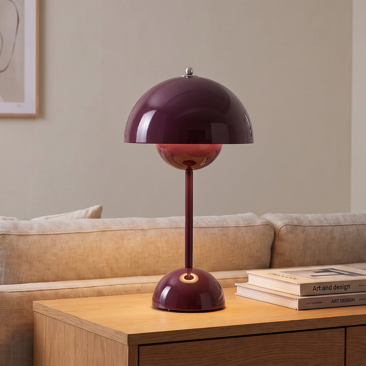 Oona table lamp in Deep Plum on a sideboard beside a sofa