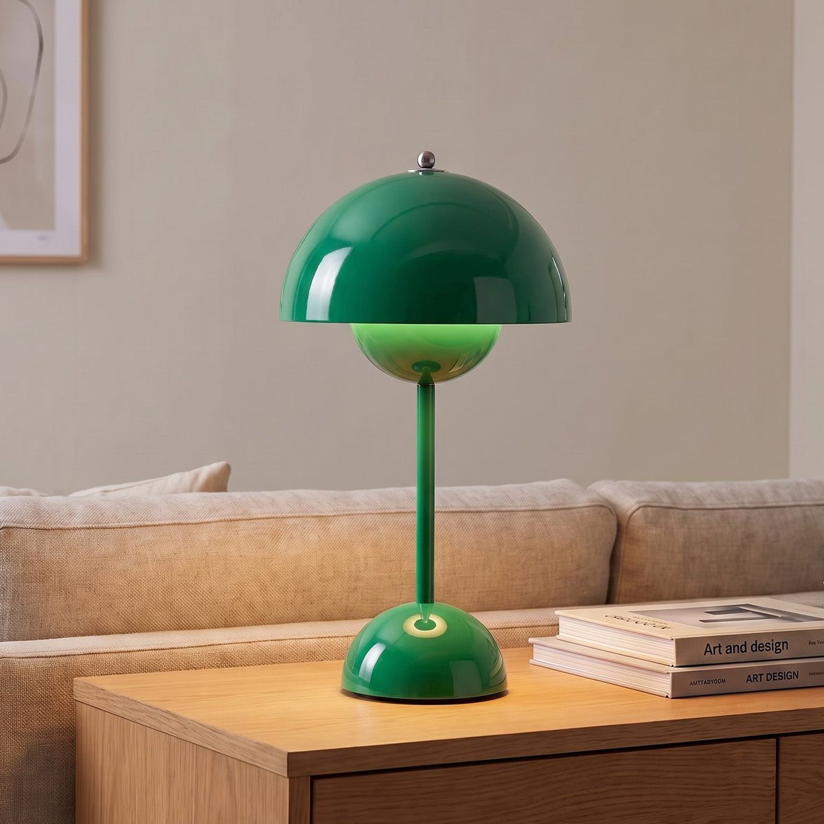 Oona table lamp in Green on a sideboard beside a sofa