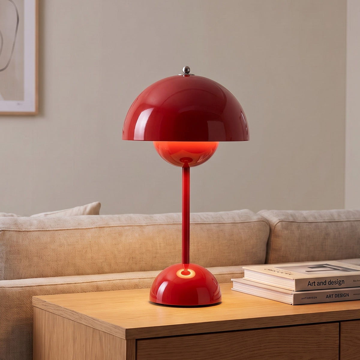 Oona table lamp in Red on a sideboard beside a sofa