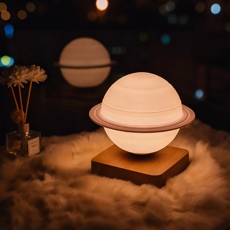 Orsa Saturn lamp floating above an oak base