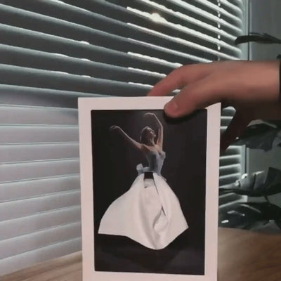 Tissue pulled through the lighted tissue box to form the ballerina skirt