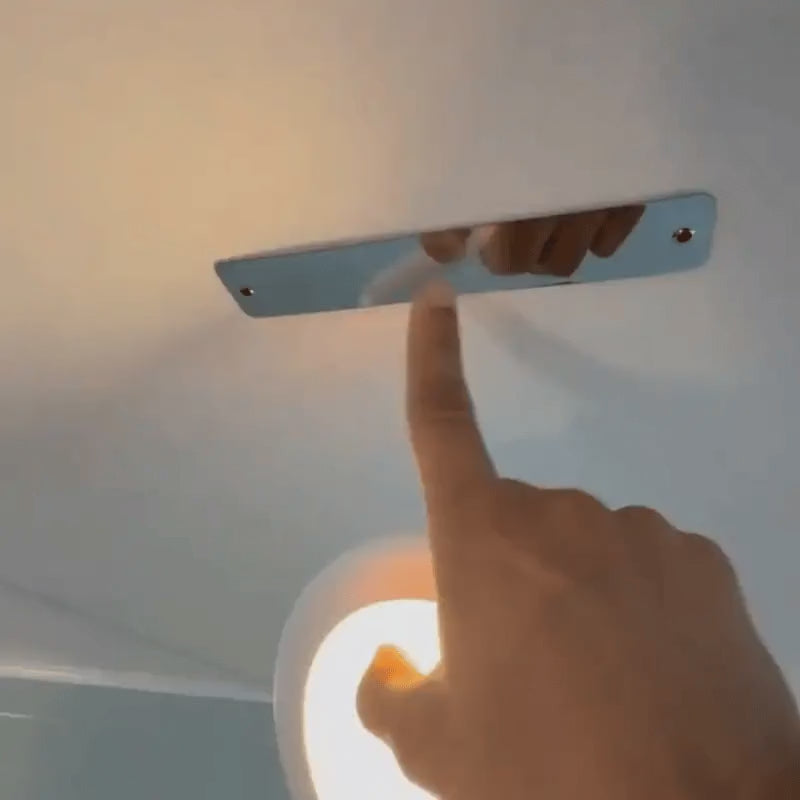Motion sensor ceiling light snapped onto its magnetic mount and set by remote