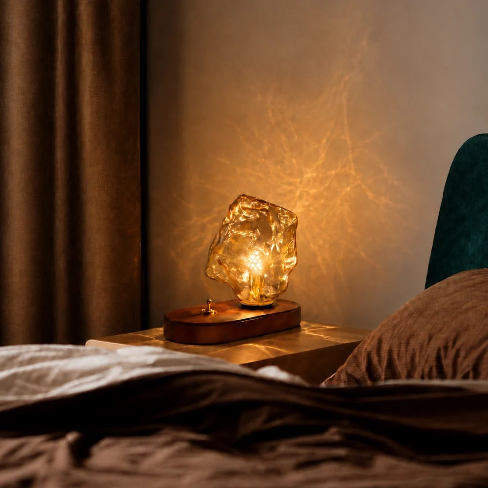 Ribe lamp glowing on a bedside table at night