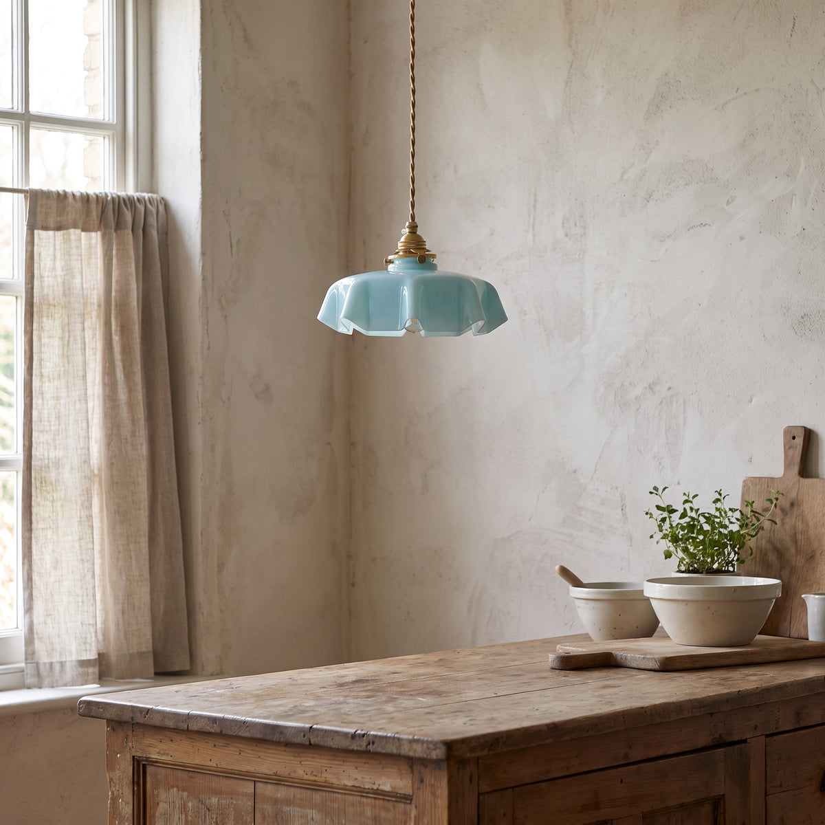 Ronja pendant light in turquoise glass above a kitchen counter