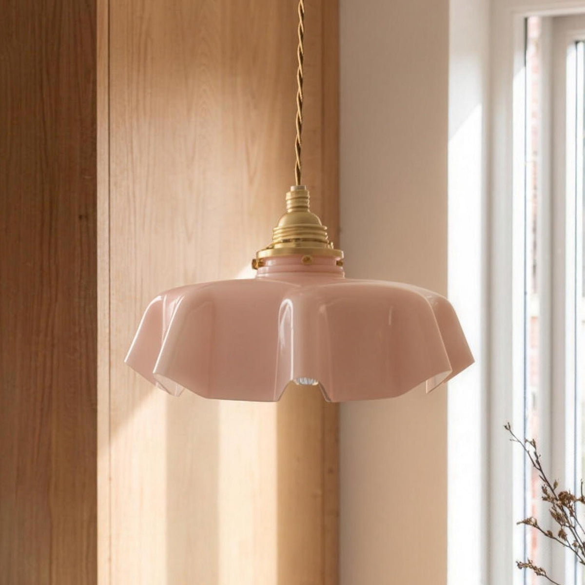 Ronja pendant light in rose glass over a kitchen table