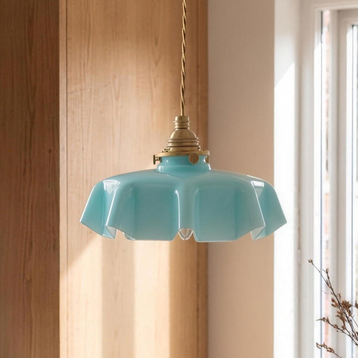 Ronja pendant light in turquoise glass over a kitchen table
