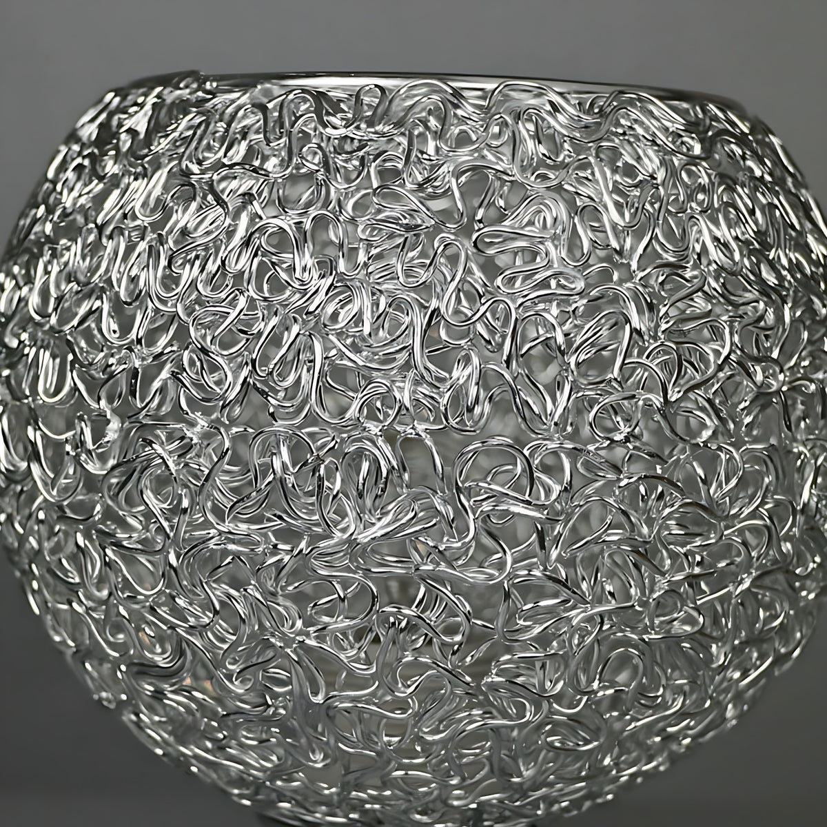 Close view of the tangled wire shade of the Saara light