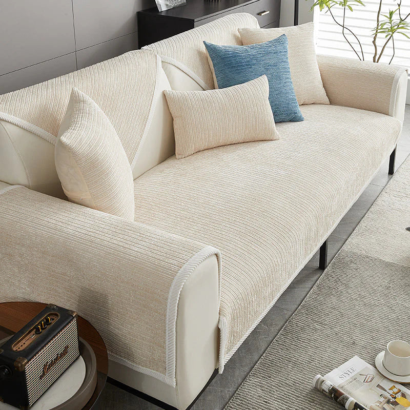 Beige ribbed sofa cover on a sofa seat and arm