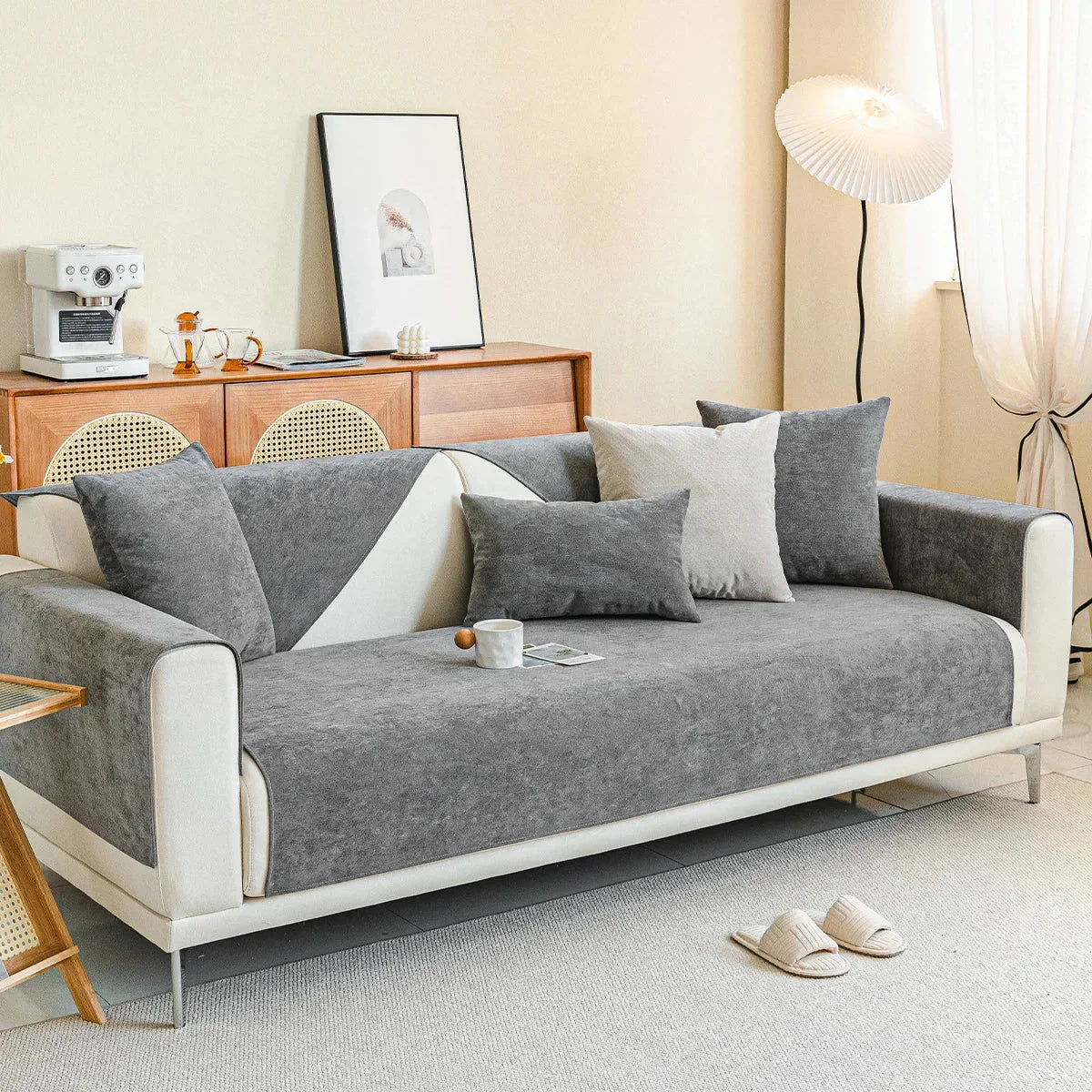 Gray ribbed sofa covers on a white sofa beside a sideboard