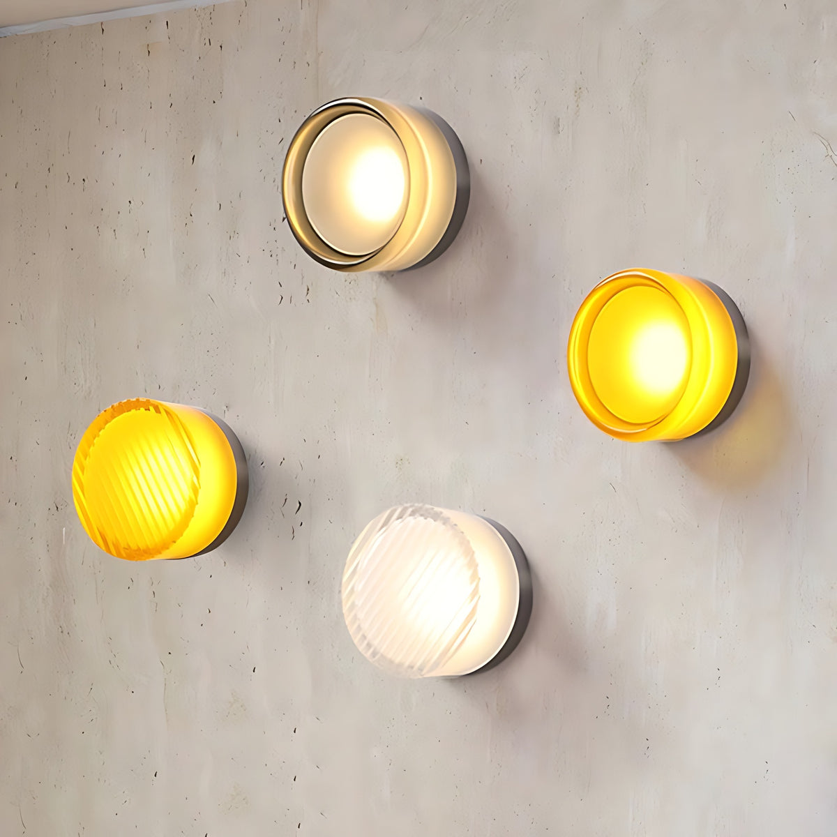 Siv LED wall sconce in three colors side by side