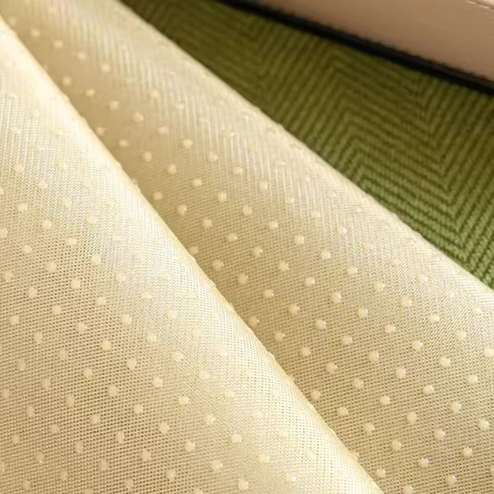 Close view of the dotted non slip backing of the sofa seat cover