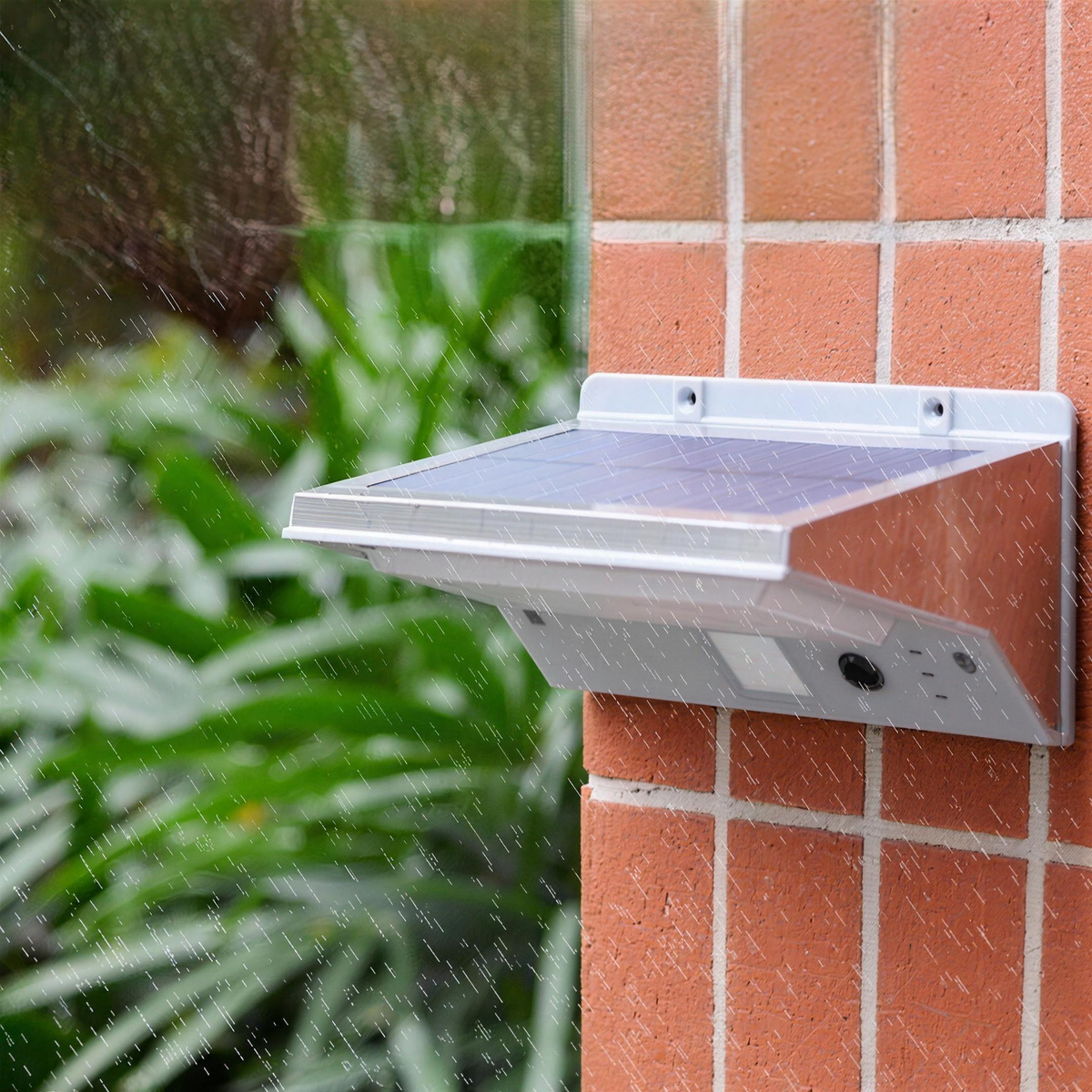 Solar wall light, Sensor Panel, on a brick wall in the rain