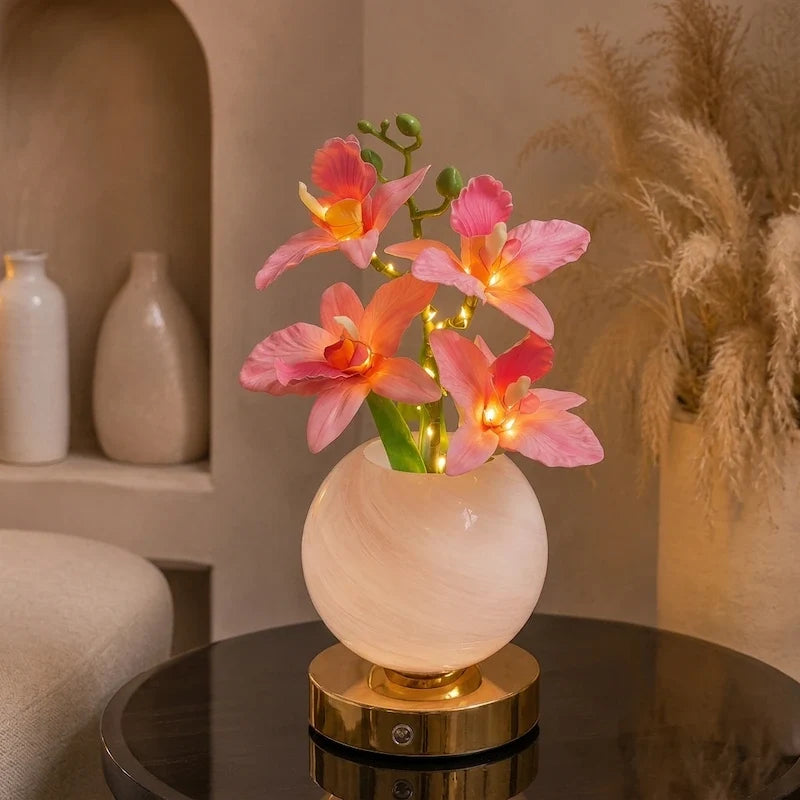 Solna orchid lamp in Blush beside two white vases