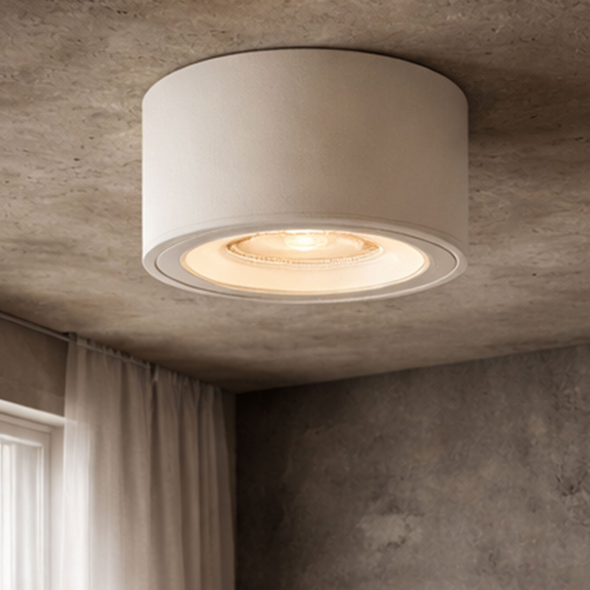 Ceiling light fixture on a textured ceiling with soft lighting