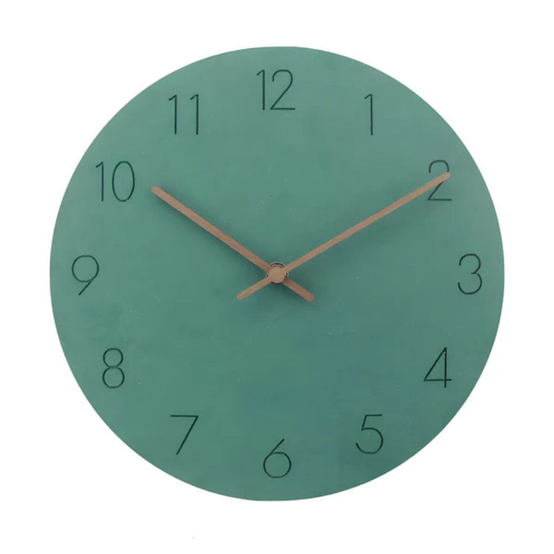 Sage green dial wall clock with black numerals and wooden hands on a white background