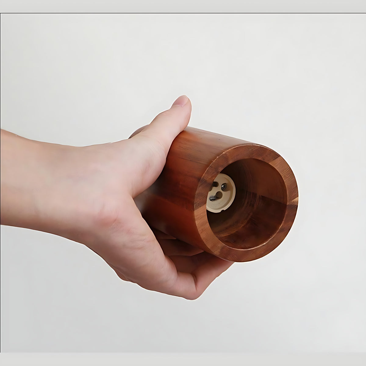 Inside a Svea walnut shade showing the bulb socket