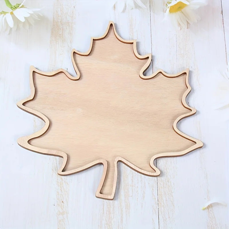 Empty maple leaf serving tray on white wood