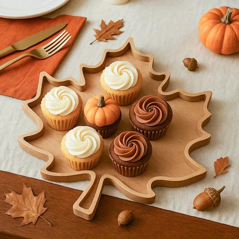 Maple leaf tray with cupcakes on a fall table