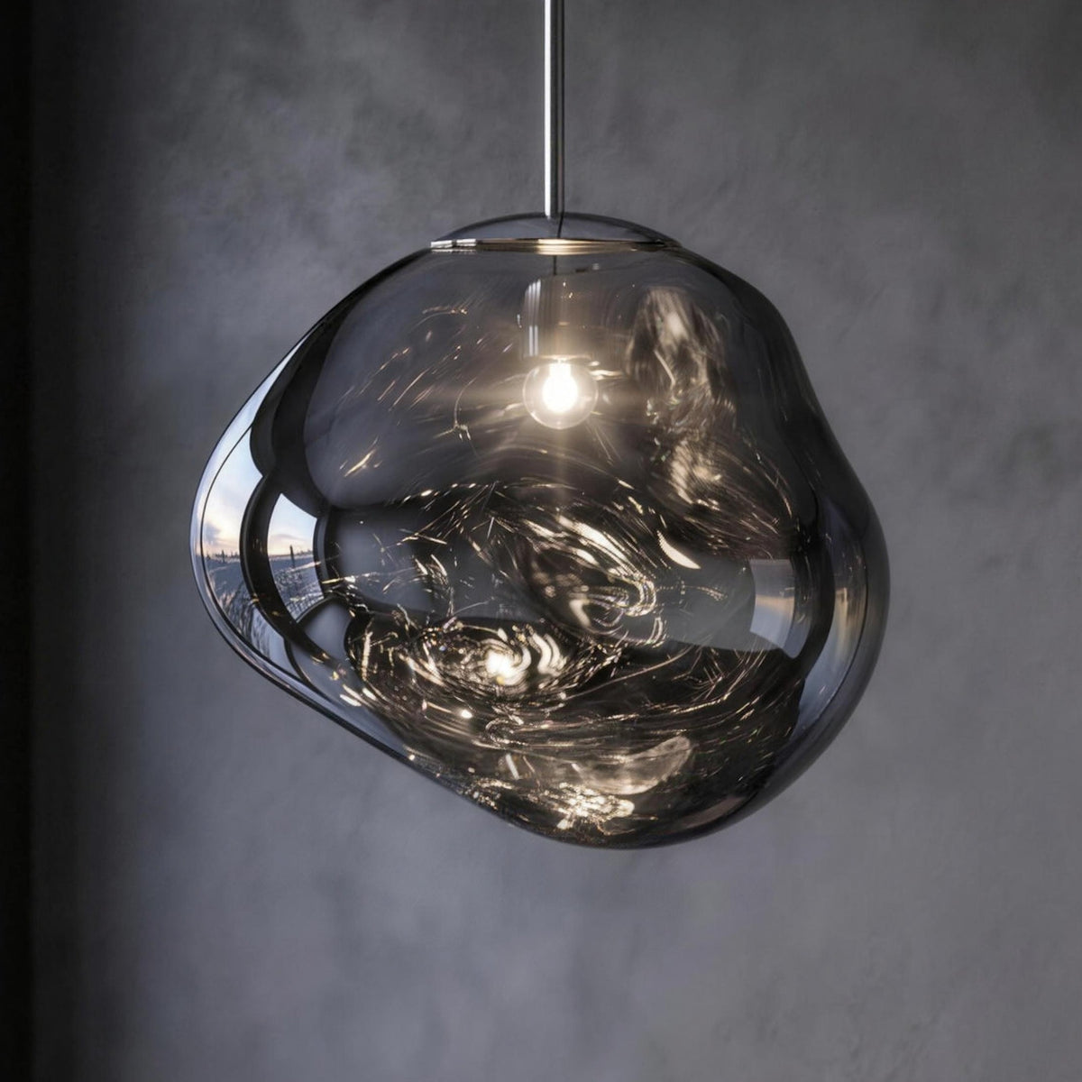 Tora pendant light, silver molten shade on a chrome rod, lit