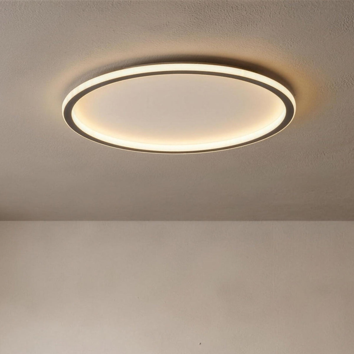 Viivi LED ceiling light, black halo ring, flush to the ceiling and lit
