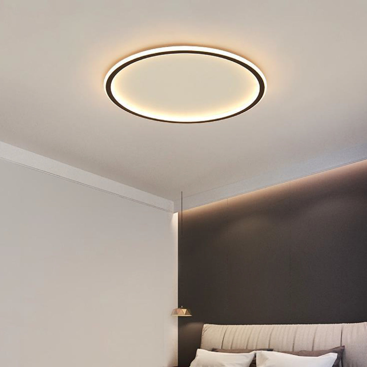 Viivi LED ceiling light, black halo ring lit around its edge on a bedroom ceiling