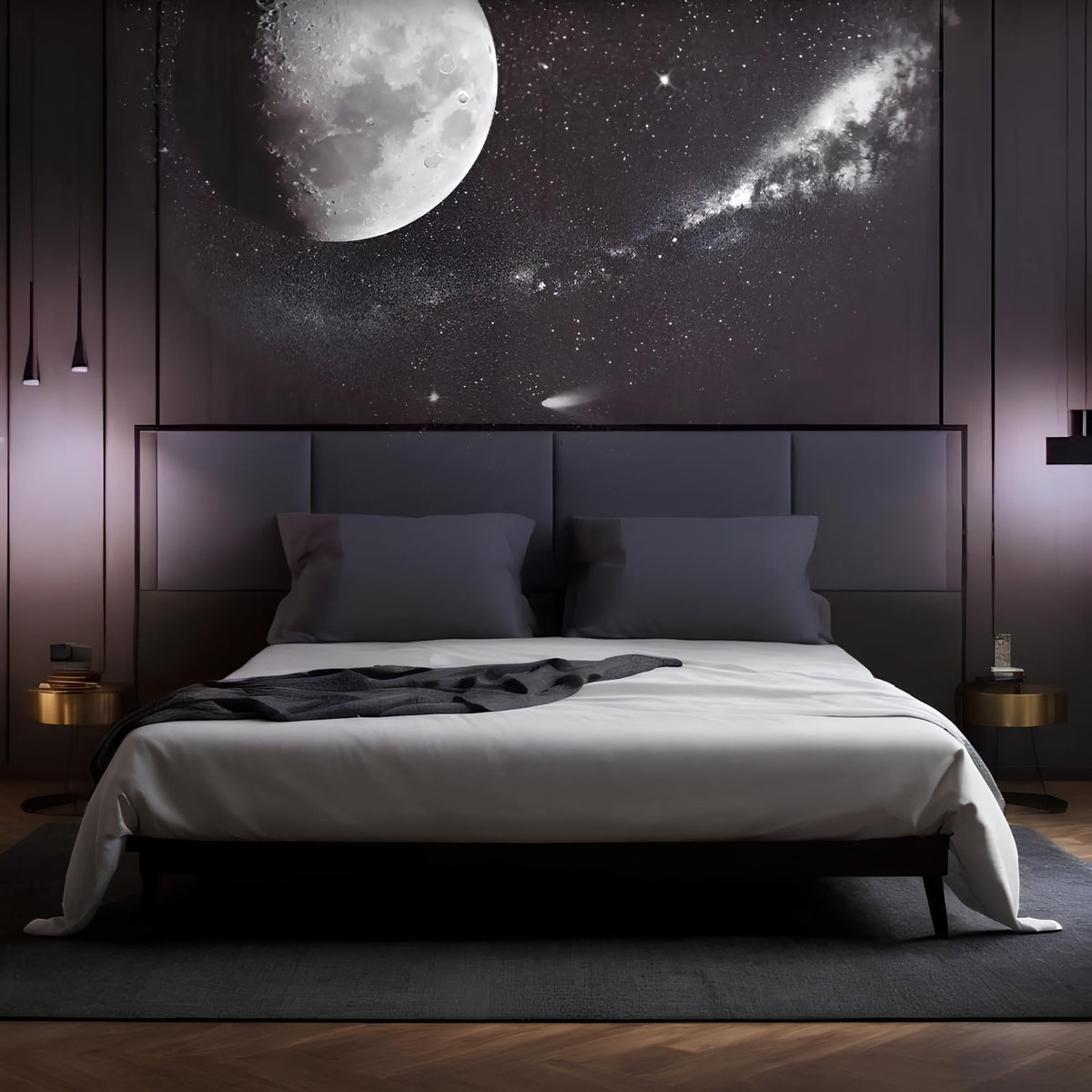 Moon and stars projected above a bed