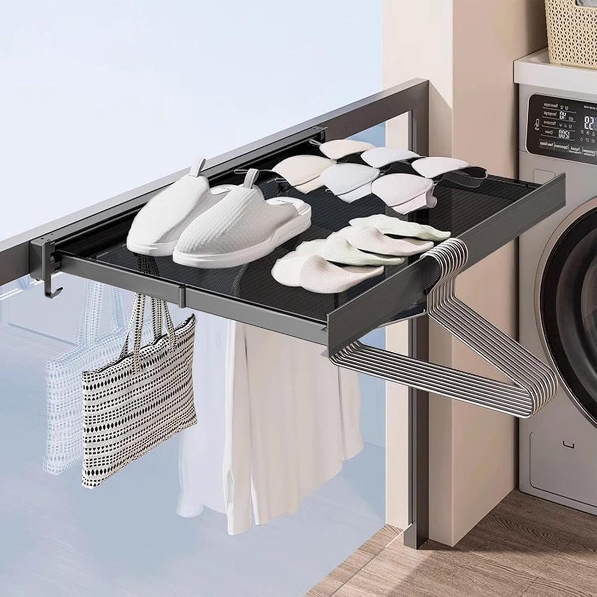 Wall drying rack open by a washer with shoes on the shelf and hangers on the hooks
