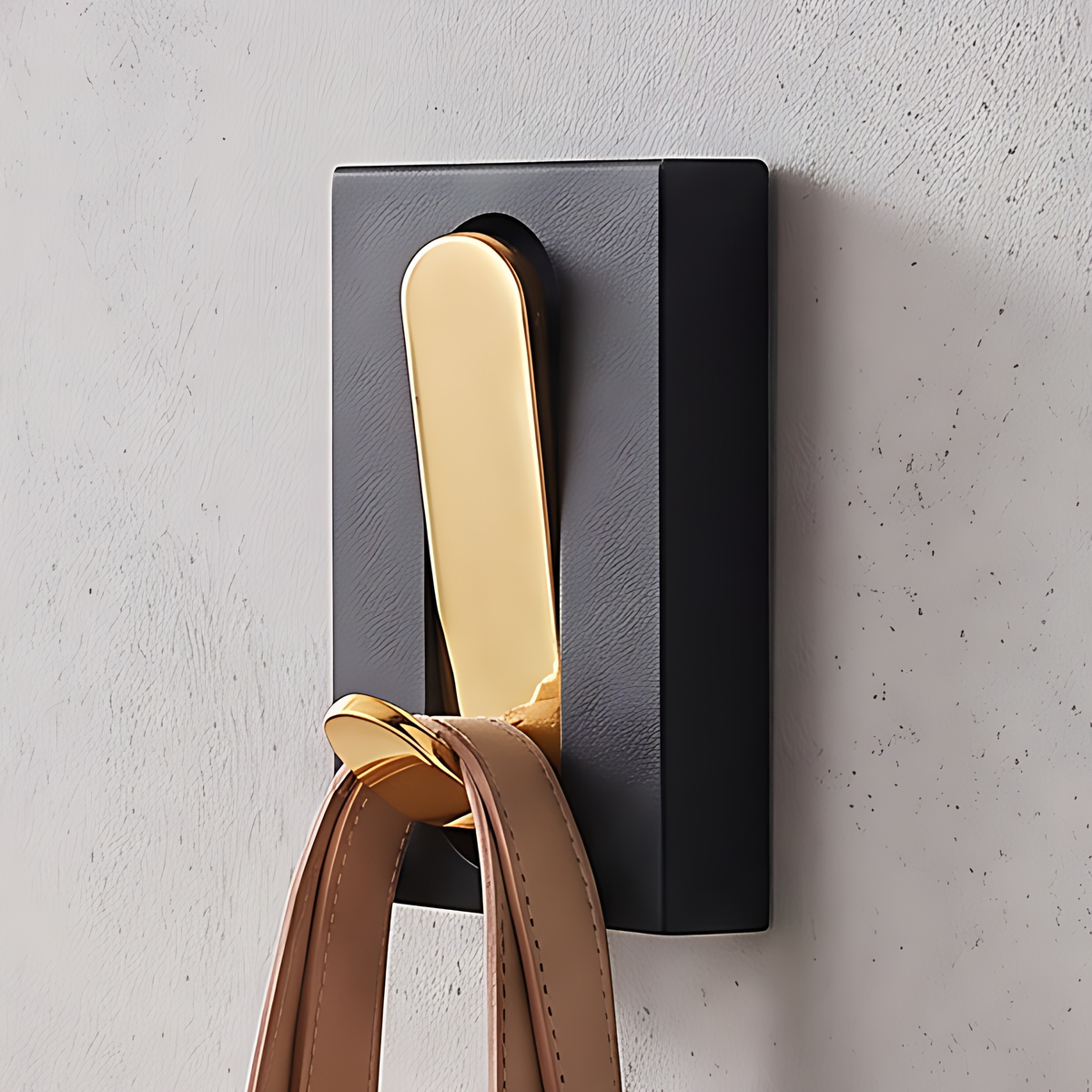 Wall hook with a gold hook, 1 hook, 2", on a warm plaster wall