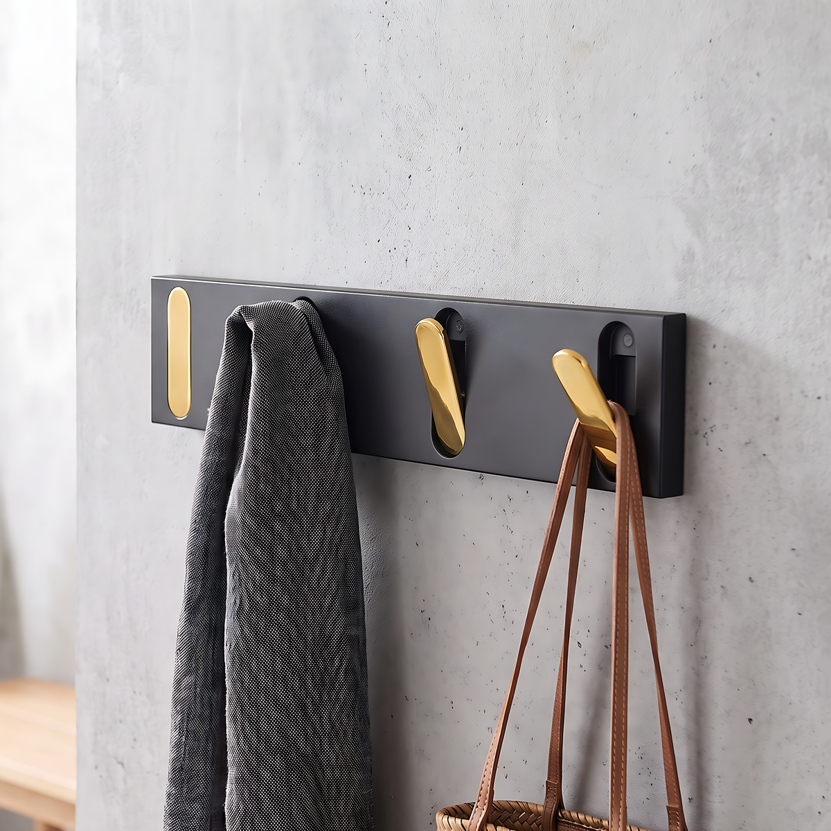 Wall hook rack with gold hooks, 4 hooks, 12.6", on a warm plaster wall