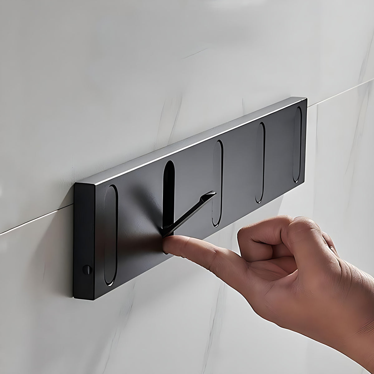Flipping a hook out of the black wall hook rack