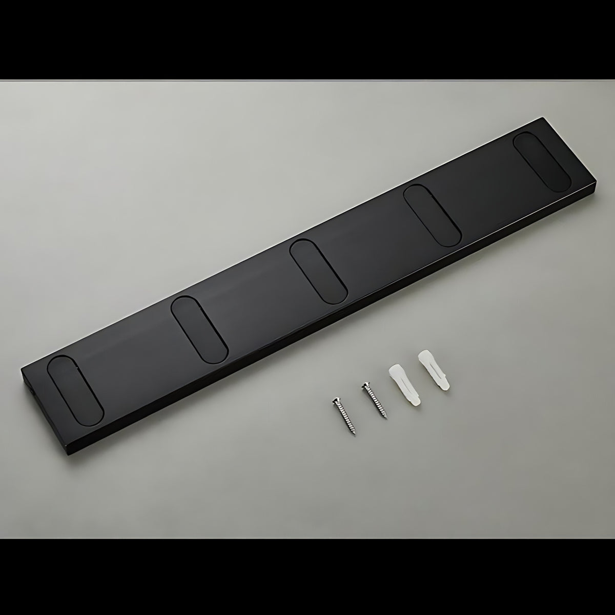 Black wall hook rack with screws and wall anchors